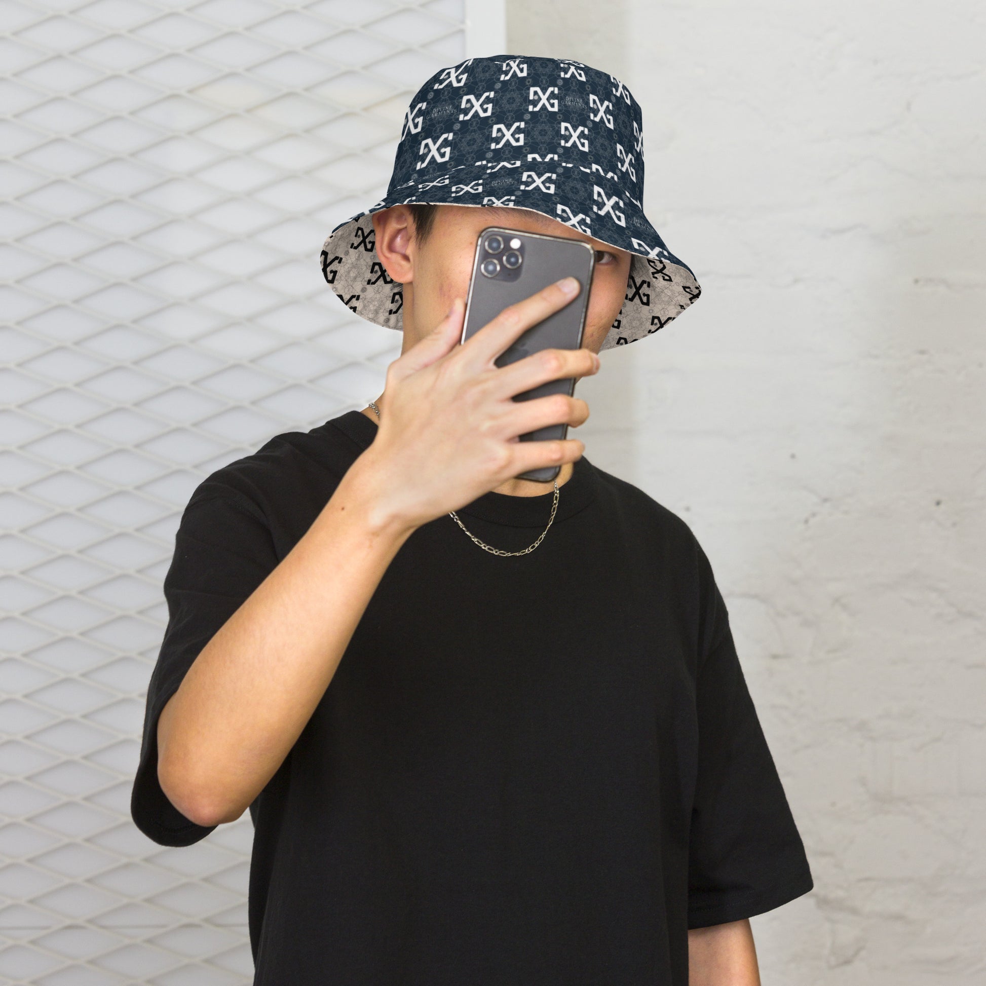 Introducing the ultimate streetwear accessory: the Divine Garments Reversible Bucket Hat! Proudly featuring the signature DG sacred geometry design, and inspired by the ancient Metatron's cube, this hat serves as a powerful symbol of protection and positive energy.