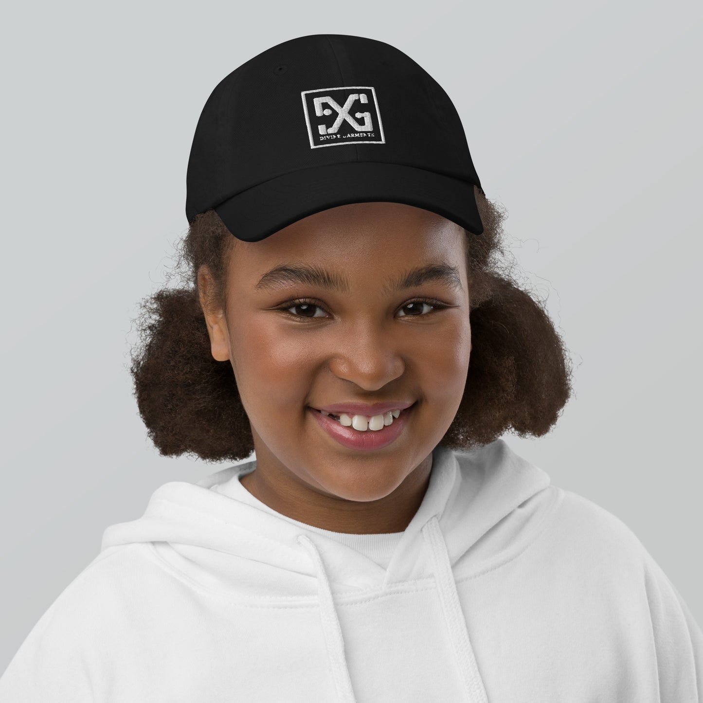 Elevate your child's style and performance with the Divine Garments Youth Cap!