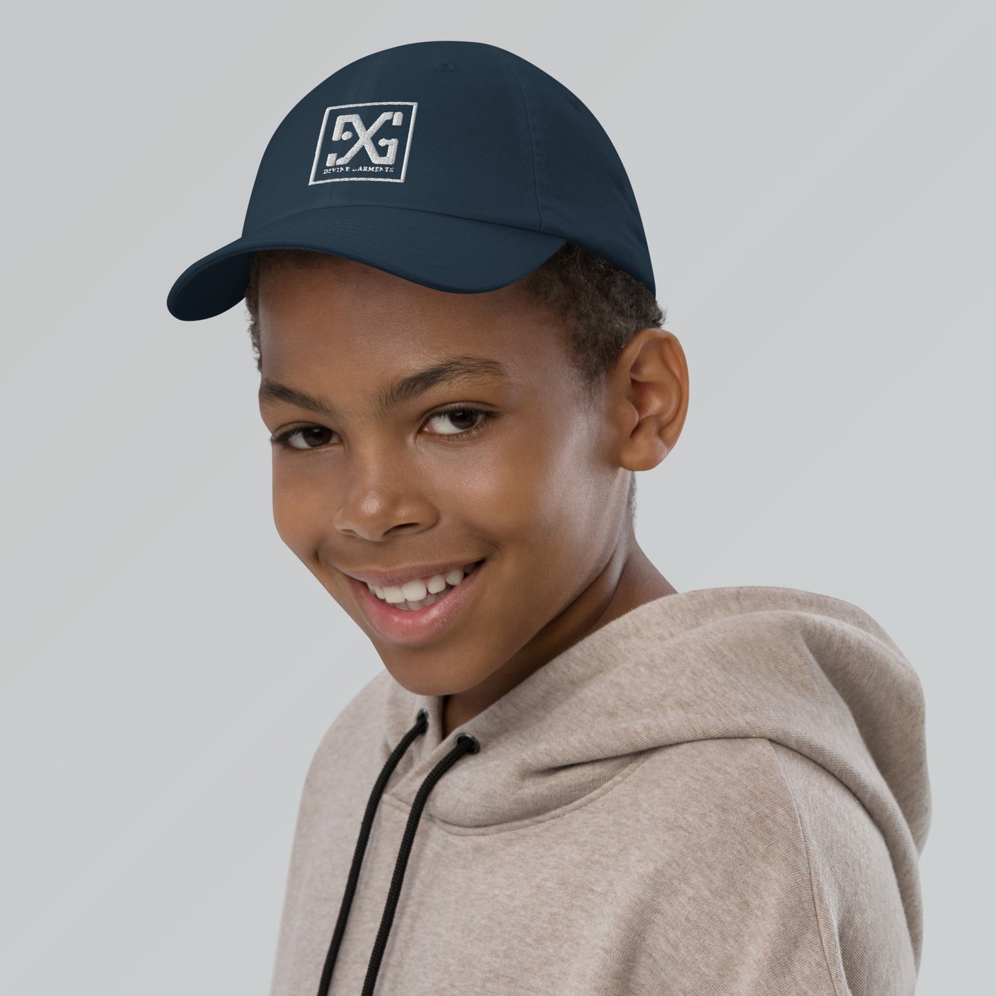 Elevate your child's style and performance with the Divine Garments Youth Cap!