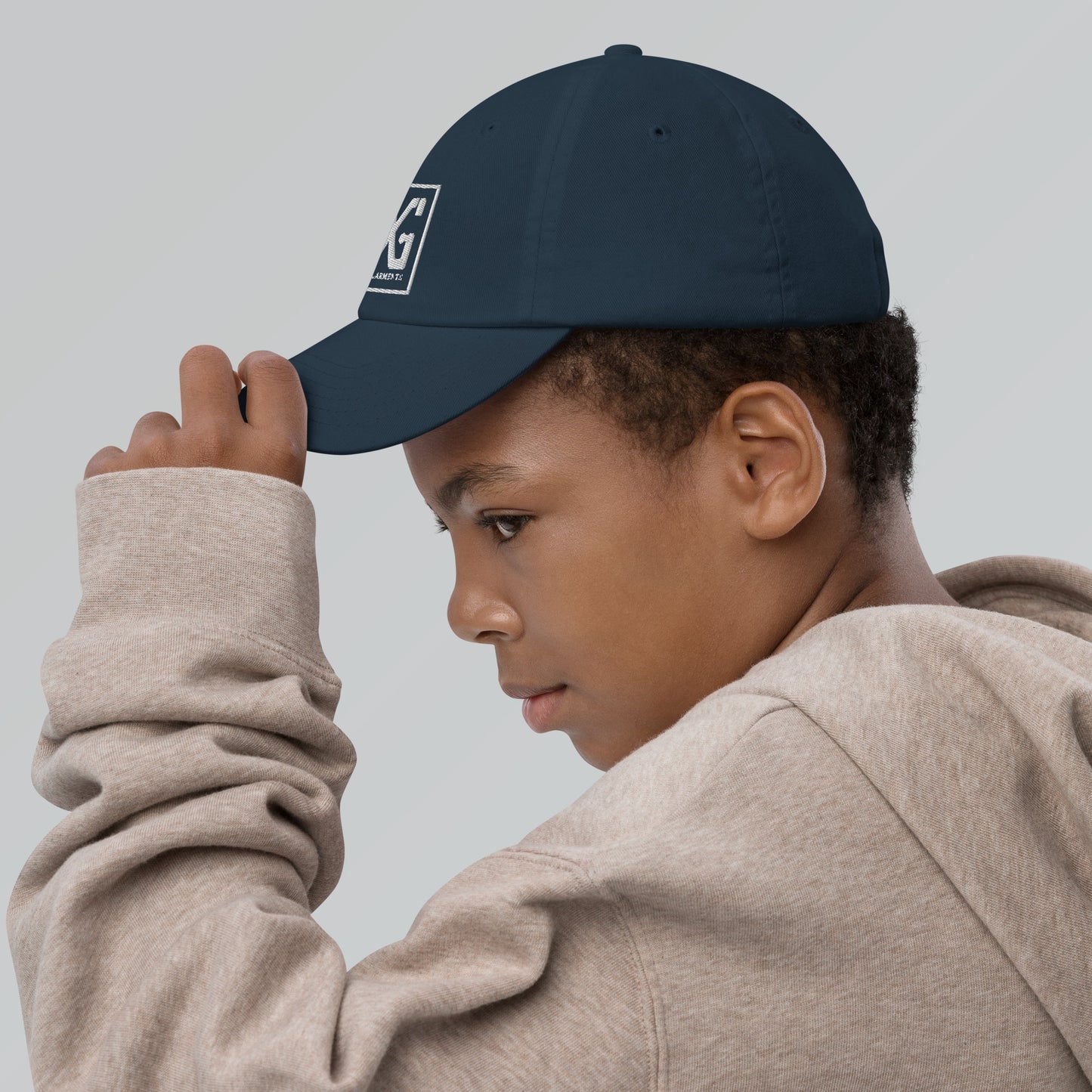 Elevate your child's style and performance with the Divine Garments Youth Cap!