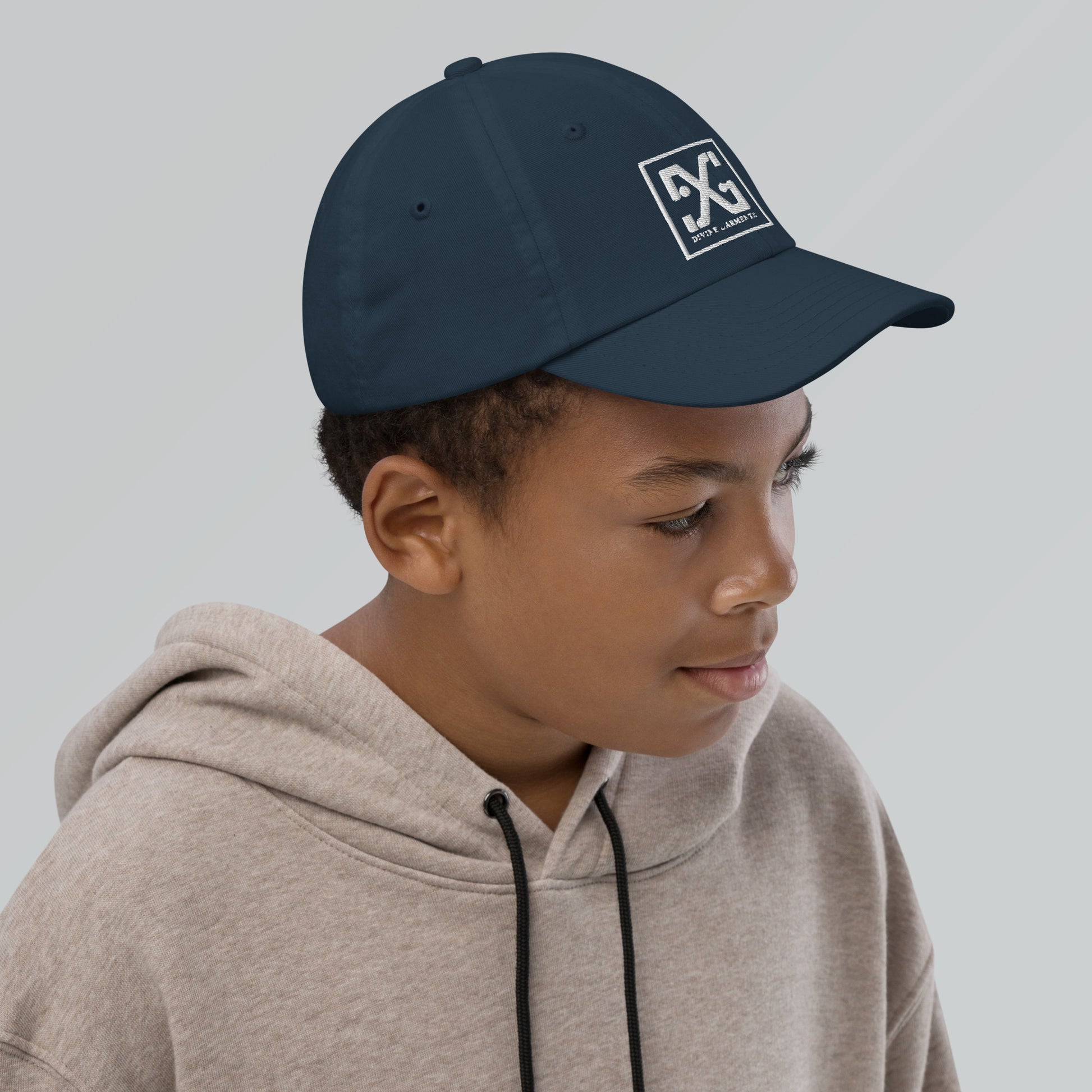 Elevate your child's style and performance with the Divine Garments Youth Cap!